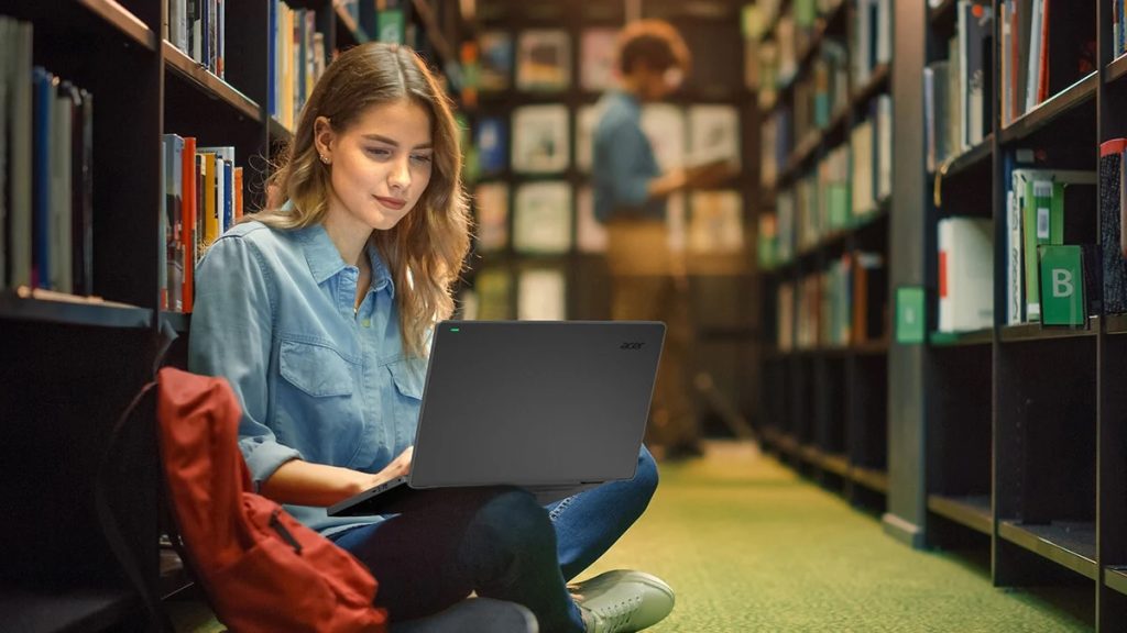 College student using a budget-friendly laptop under $500 for studying and streaming in 2025