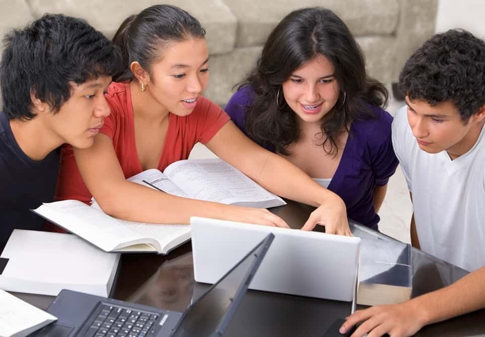Students collaborating with budget laptops under $500 for study and group projects