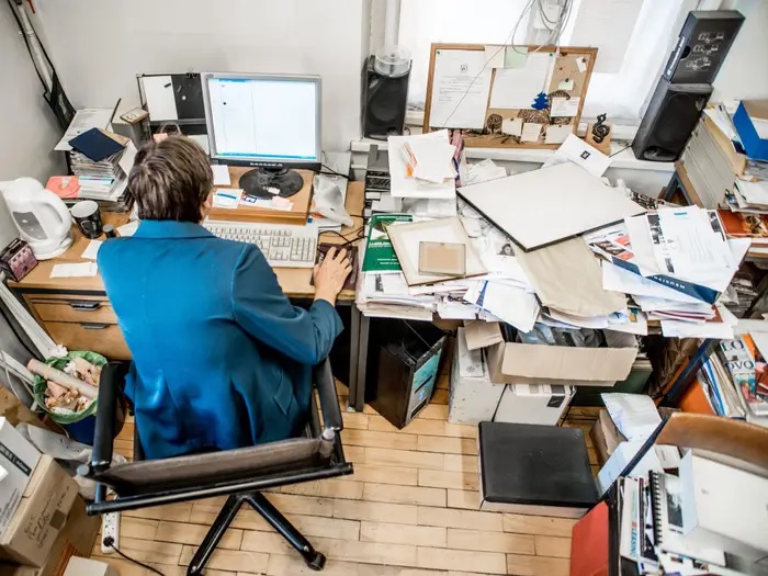 common work-from-home setup mistakes including cluttered desk and poor lighting